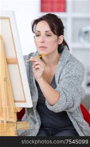 focused painter and her painting