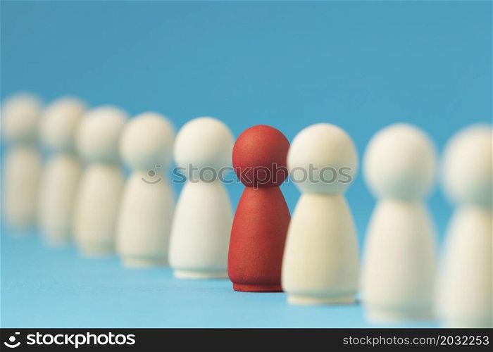 focused red pawn surrounded by white ones