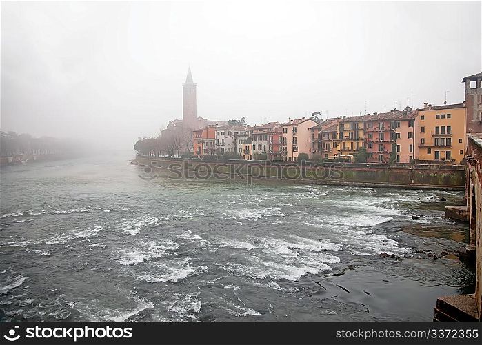 Fog above the river in Verona, Italy
