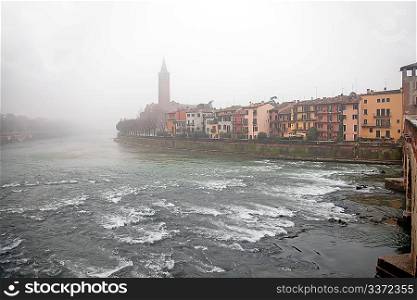 Fog above the river in Verona, Italy