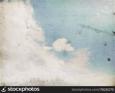 Fog and clouds on a vintage, textured paper background with a color gradient.