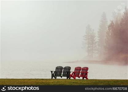 Fog on the lake. Misty mountain lake in the early serene morning in mountains.