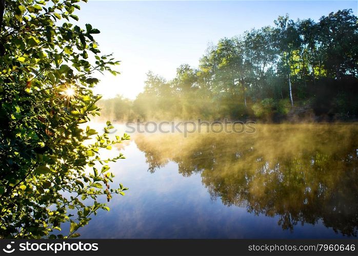 Fog on the morning river in late summer