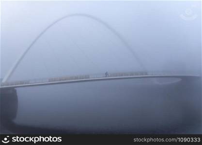 Fog on the Tyne. Gateshead Millennium Bridge shrouded in fog