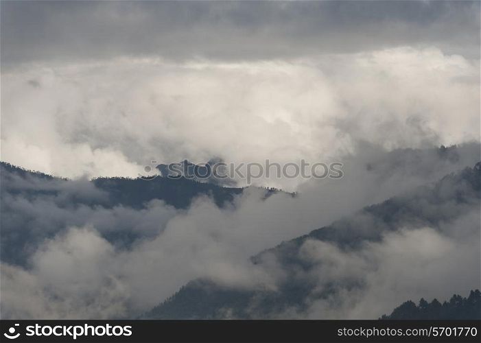 Fog over mountains, Chokhor Valley, Bumthang District, Bhutan