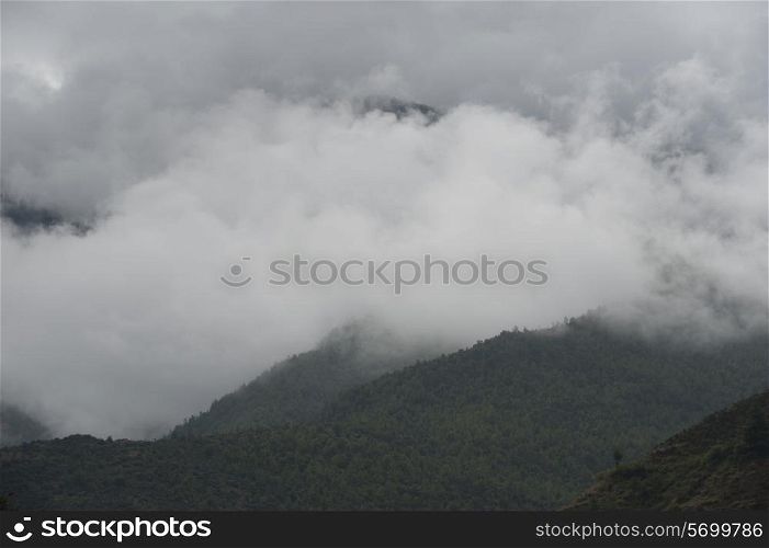 Fog over mountains, Tamchhog Lhakhang, Paro Valley, Paro District, Bhutan