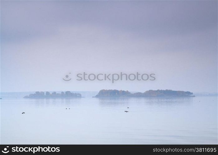 fog over the sea and the island
