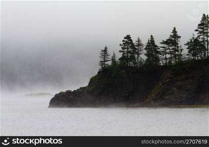 Fog veils island and small peninsula