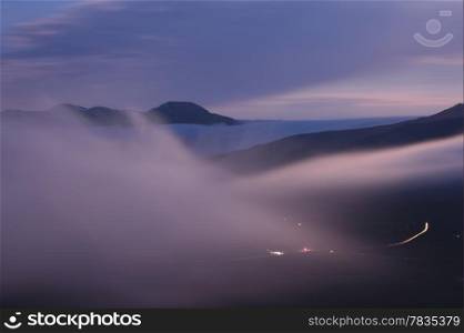 Foggy mountain valley before sunrise. Demerdzhi area, Crimea, Ukraine