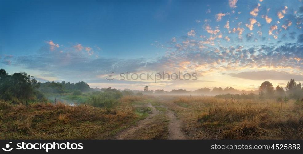 Foggy river in the autumn morning. Panorama