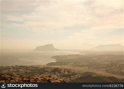 Foggy sunset with aerial Alicante Calpe view from Benitatxell in spain