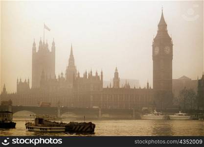 Foggy view of Big Ben and Parliament in London, England