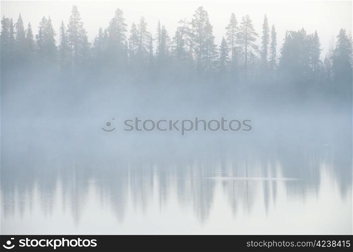Foggy weather early in the morning on the lake.