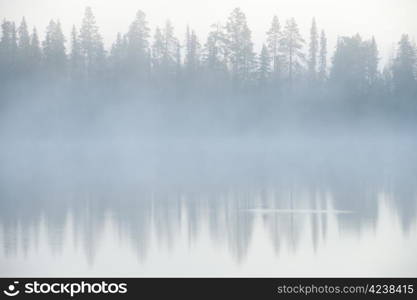 Foggy weather early in the morning on the lake.