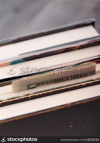 Folded banknotes hidden in books