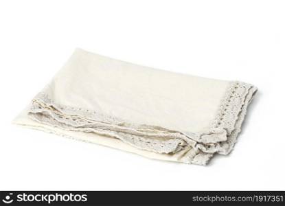 folded beige linen towel on white background, top view