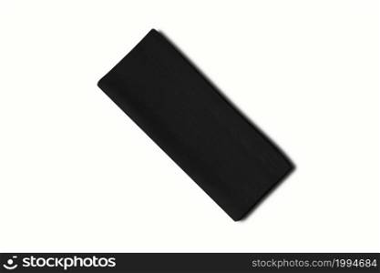 Folded black cotton napkin isolated on white background
