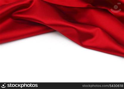 Folded red satin on white background