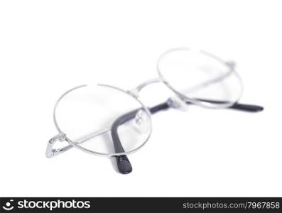 Folded round eyeglasses isolated on white background