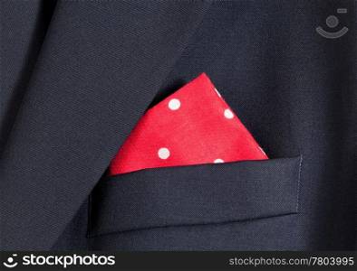 Folder linen handkerchiefs in red with white spots in top pocket of blazer