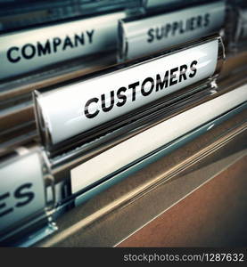 Folder tab with focus on the the word customer. Business or clients base concept image with blur effect.. Customers Base or File Concept