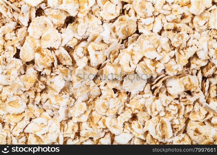 food background - dry oat flakes close up
