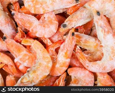 food background - many frozen boiled red shrimps close up