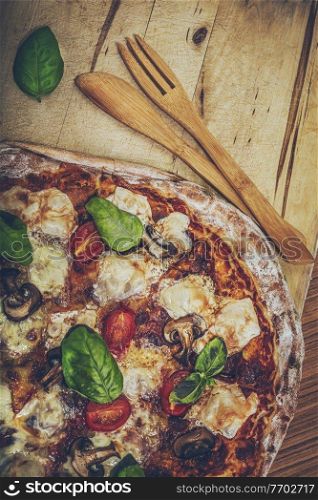 Food Background. Tasty Hot Pizza Served with Wooden Utensils. Delicious Fast Food. Traditional Italian Dish.. Hot Delicious Pizza