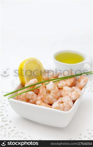 food background with fresh shrimps and lemon