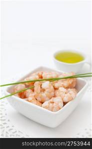 food background with fresh shrimps and oil