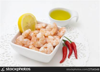 food background with fresh shrimps and red pepper
