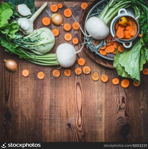 Food background with organic local vegetables for healthy clean eating and cooking on rustic wooden , top view, place for text. Vegan or vegetarian food concept