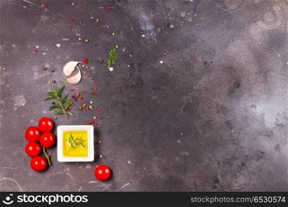 Food background with spices. Food background - spices, olive oil and tomatoes on dark background with copy space