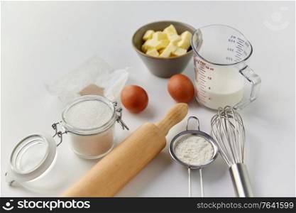 food, baking and culinary concept - ingredients and tools for cooking on table. ingredients and tools for food cooking on table