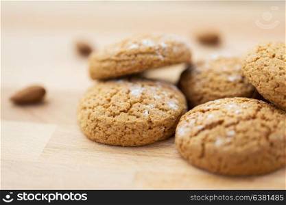food, baking and eating concept - close up of homemade oatmeal cookies on wooden table. close up of oatmeal cookies on wooden table