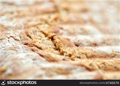 food, baking, cooking and unhealthy eating concept - close up of white bread