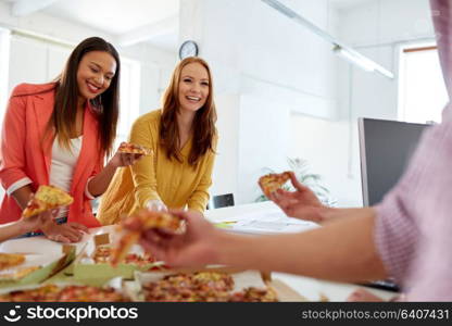 food, business lunch and people concept - happy creative team eating pizza at office. happy business team eating pizza at office