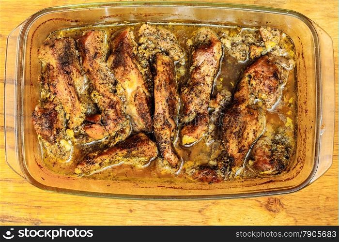 Food. Closeup of roasted chicken meat with spices and herbs in glass dish. Cooking and traditional cuisine.