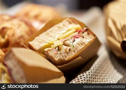 food, cooking and sale concept - craft sandwich at grocery store. craft sandwich at grocery store