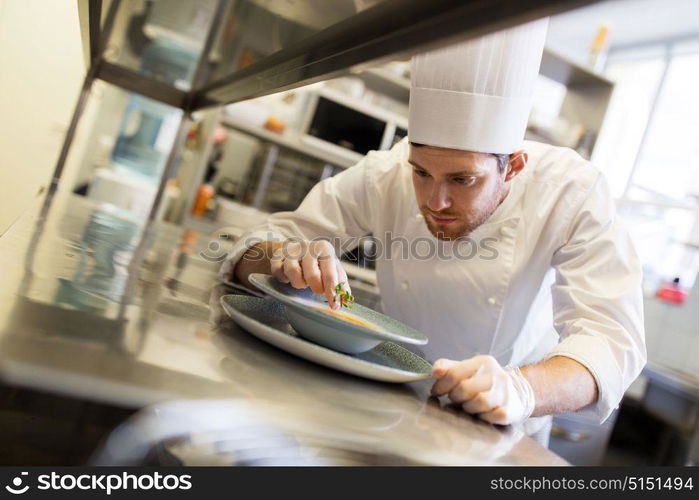 food cooking, profession and people concept - happy male chef cook serving plate of soup at restaurant kitchen. happy male chef cooking food at restaurant kitchen