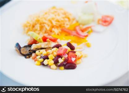 food, culinary, cuisine and cooking concept - vegetable salad on plate at restaurant or cafe. vegetable salad on plate