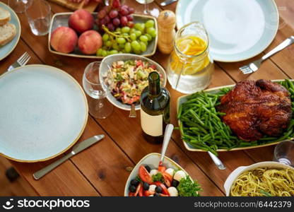 food, culinary, thanksgiving day and eating concept - various dishes on served wooden table from top. various food on served wooden table