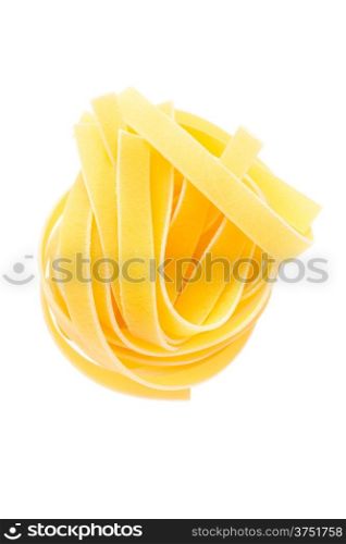 Food: dried italian pasta, fettuccine nest, isolated on white background