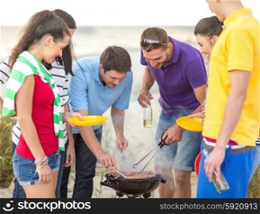 food, eating, cooking, summer holidays and people concept - group of friends having picnic and making barbecue on beach
