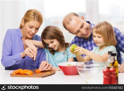 food, family, children, hapiness and people concept - happy family with two kids making dinner at home