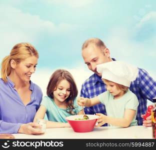 food, family, children, hapiness and people concept - happy family with two kids making dinner at home