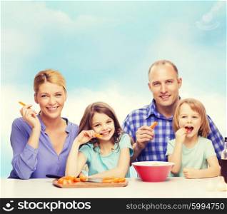 food, family, children, hapiness and people concept - happy family with two kids eating at home