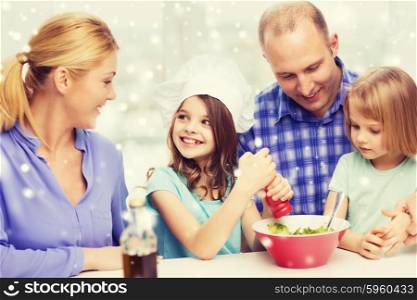 food, family, children, happiness and people concept - happy family with two kids making salad for dinner at home