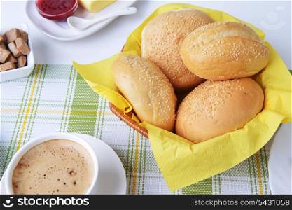 food for breakfast.coffee, buns, butter and jam