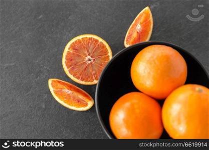 food, fruits and healthy eating concept - close up of fresh juicy blood oranges. close up of fresh juicy blood oranges